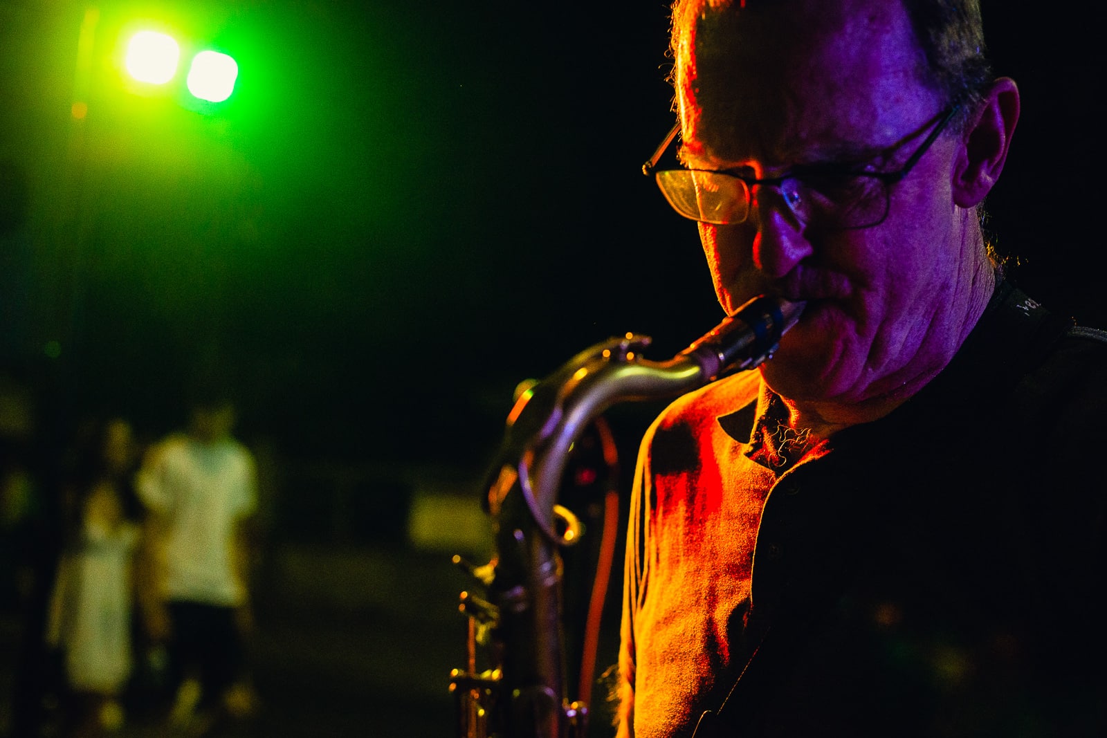 A close-up of a musician playing the saxophone